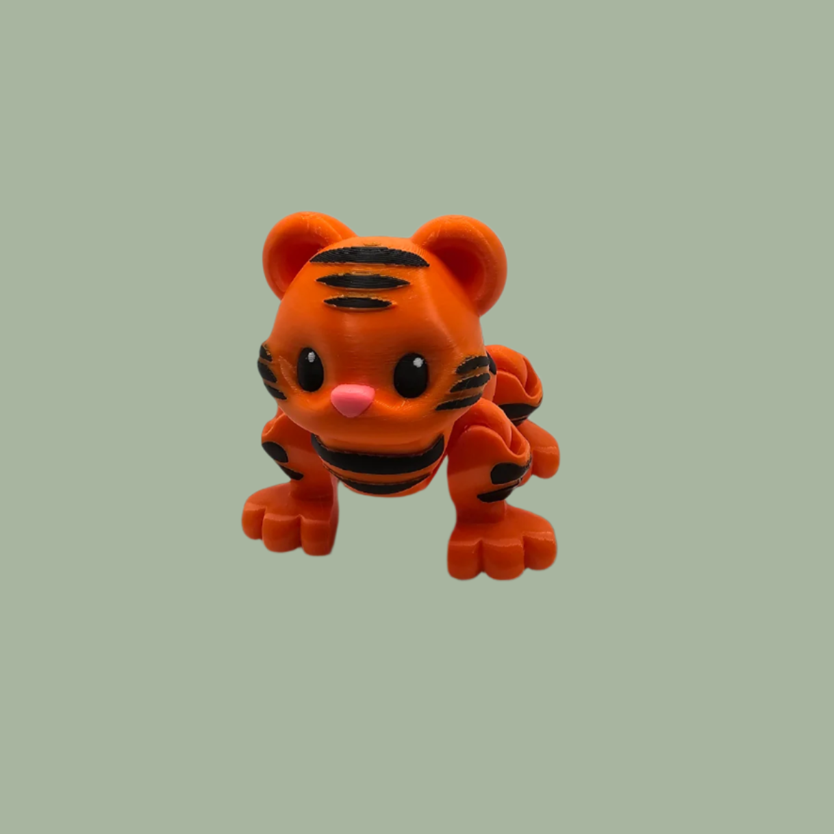 3D printed orange tiger with black stripes, with button mechanism to create a running motion