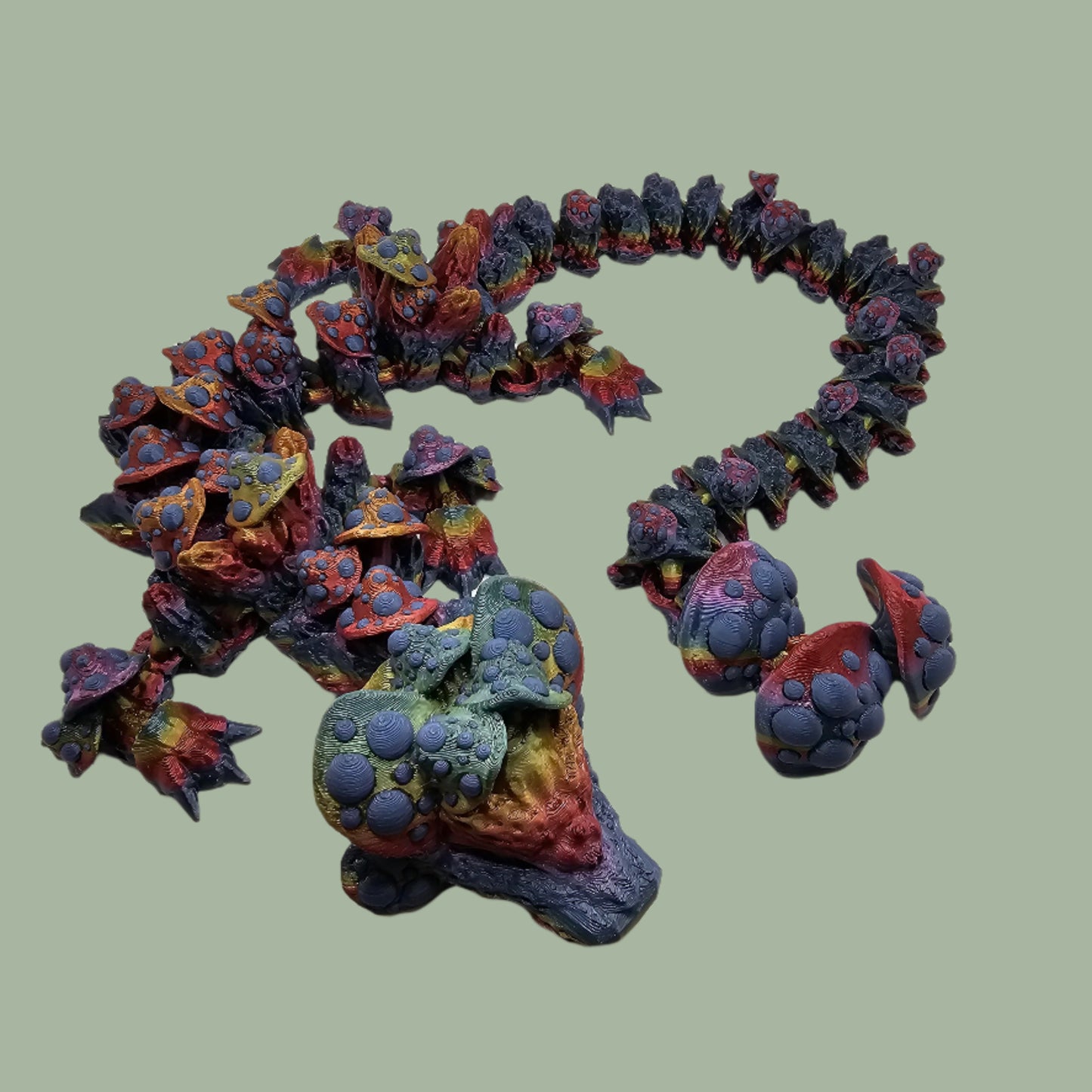 3D printed articulated dragon with mushroom details along the body