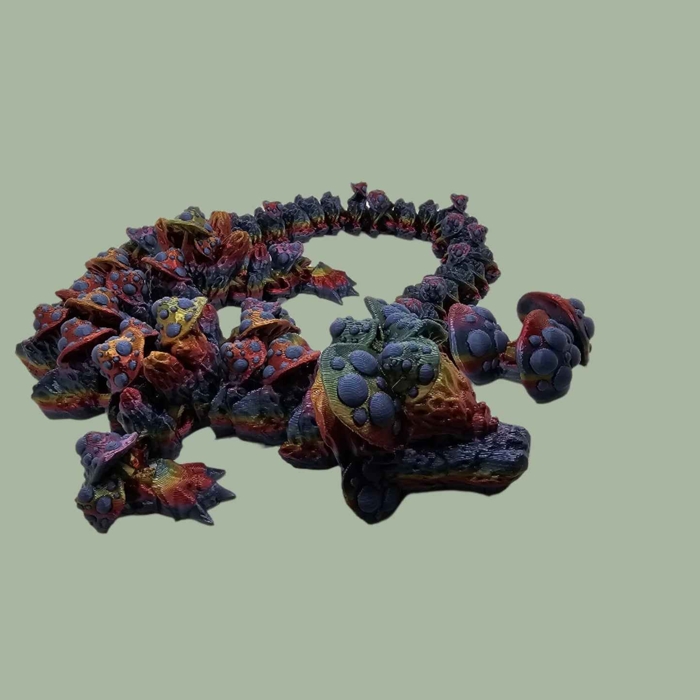 3D printed articulated dragon with mushroom details along the body