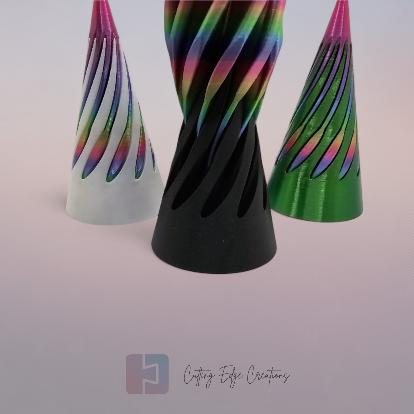 vibrant 3D-printed Infinity Cones V2, each featuring a sleek spiral cut design. The cones are in a random colour, including white, green, black, and rainbow gradients. Designed for smooth sliding and fidgeting, these eye-catching desk toys are handmade in the UK
