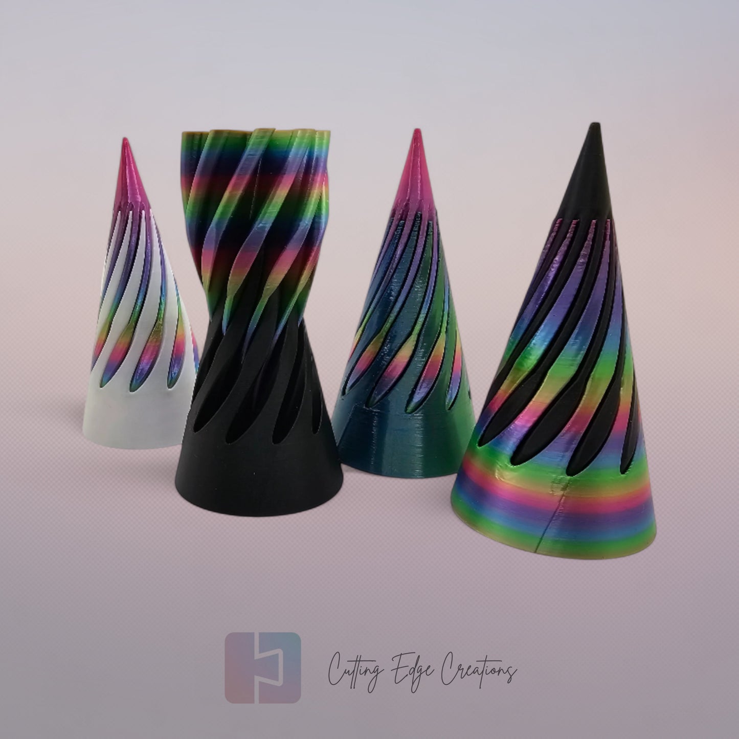 vibrant 3D-printed Infinity Cones V2, each featuring a sleek spiral cut design. The cones are in a random colour, including white, green, black, and rainbow gradients. Designed for smooth sliding and fidgeting, these eye-catching desk toys are handmade in the UK