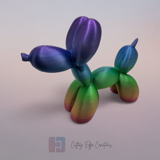 Unique rainbow balloon dog figurine, 3D printed with a smooth, glossy finish. A colourful and fun sculpture for home or office decor