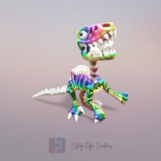 3D-printed rainbow and white skeletal velociraptor flexi toy with articulated joints, opening jaw, and bone accessory. Poseable dinosaur figure, 14cm tall, printed in the UK