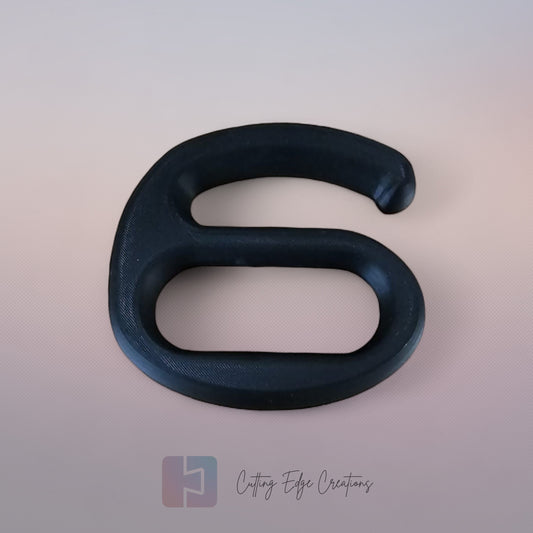 A strong black plastic handle holding multiple Aldi shopping bags in one hand against a white background.