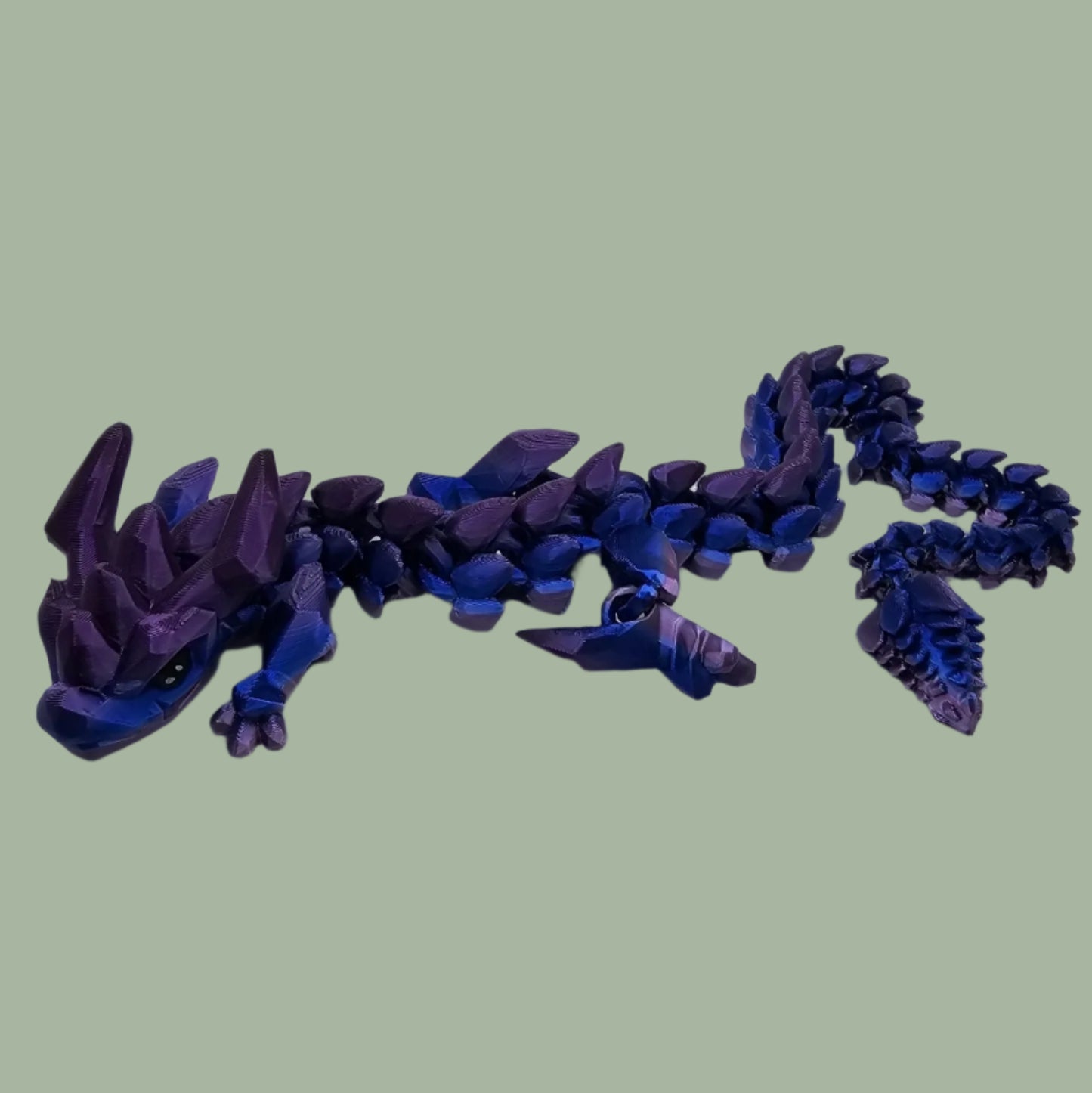 3D printed articulated dragon in a blue/purple colour
