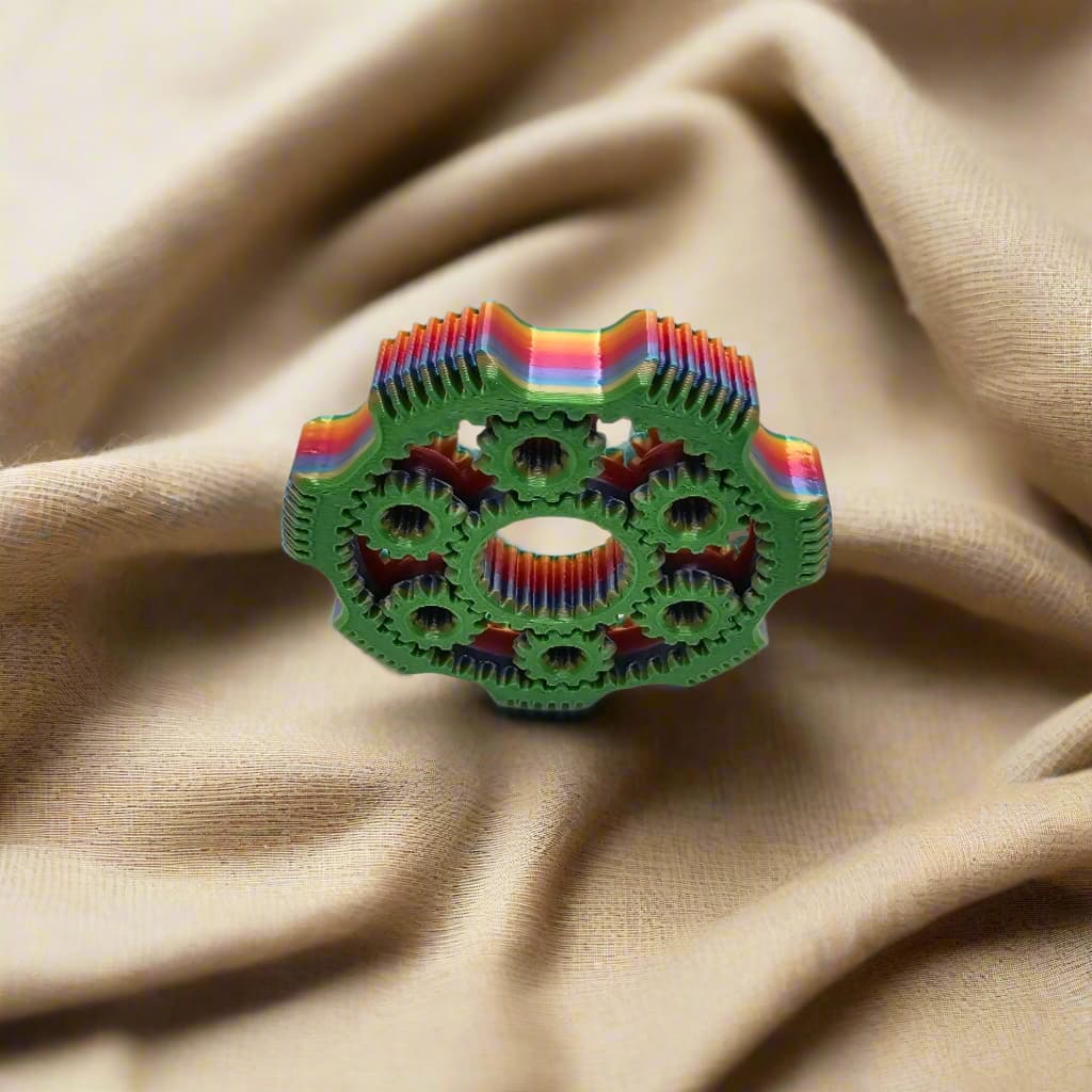 3D printed gear spinner fidget toy in multicolour filament with interlocking moving gears