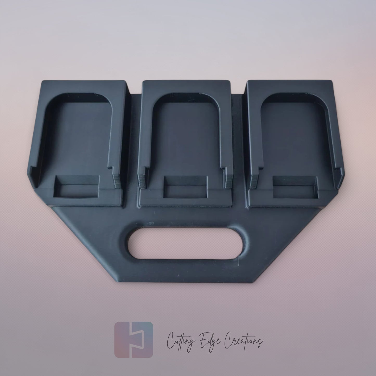 Black 3D printed battery caddy holding six Makita-compatible batteries with built-in carry handle