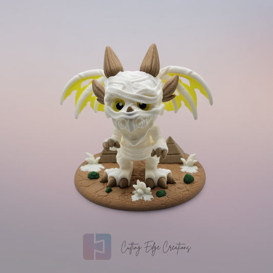 Mummy Dragon: “3D-printed Mummy Dragon figurine, articulated fidget toy with bandage design and display stand, handmade in the UK