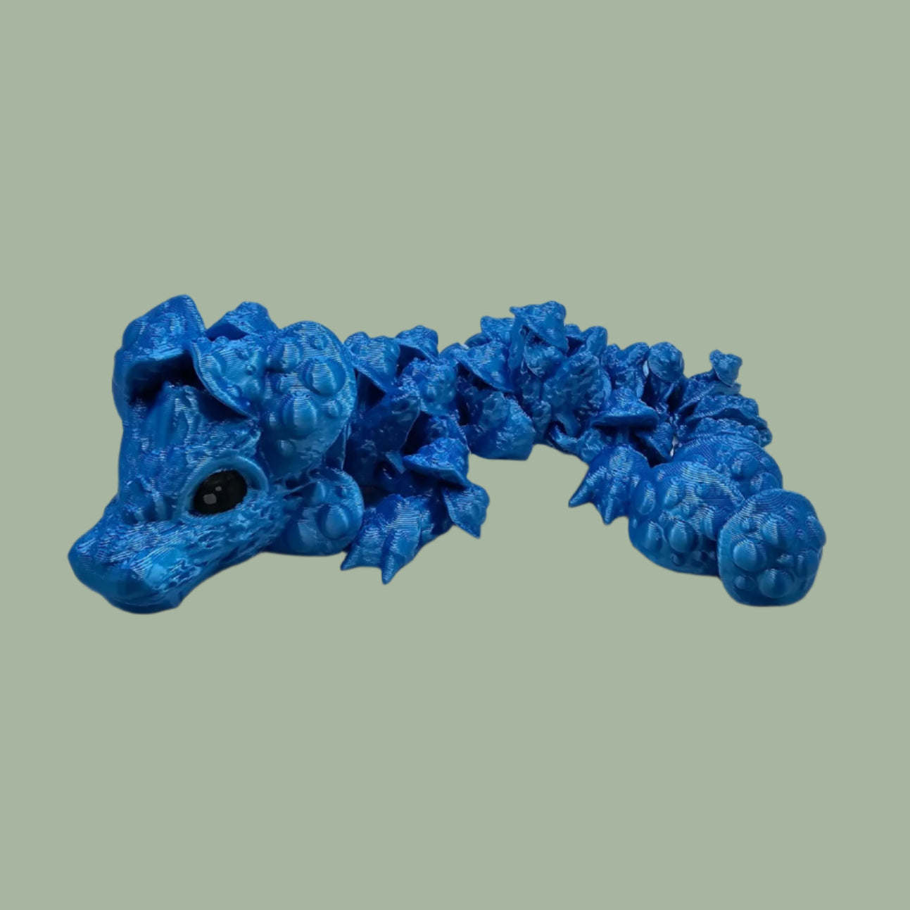 3D printed articulated dragon with mushroom details along the body