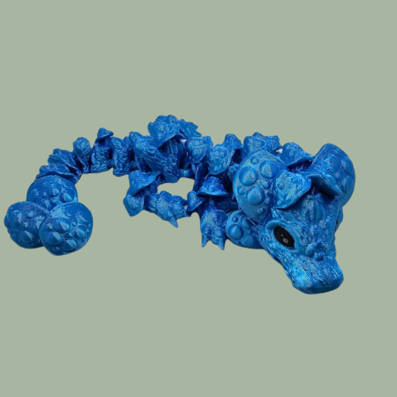 3D printed articulated dragon with mushroom details along the body