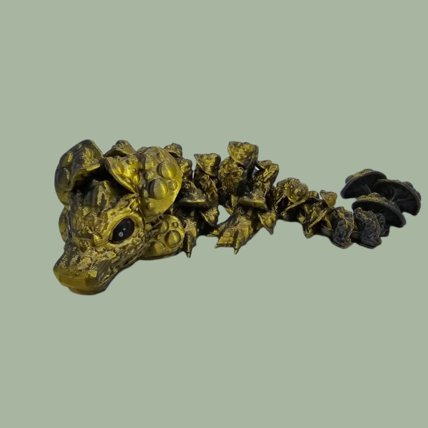 3D printed articulated dragon with mushroom details along the body