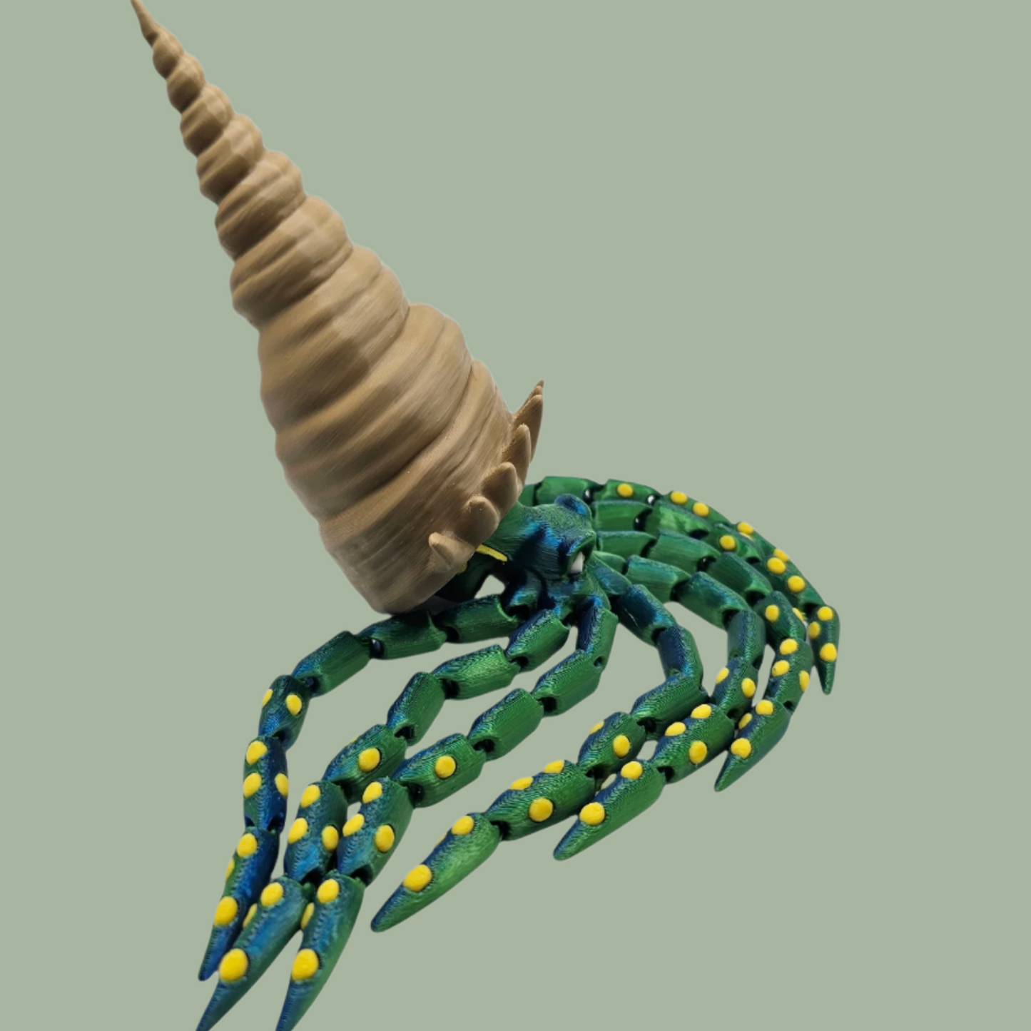 3D printed articulated green octopus with yellow spots and removeable shell hat