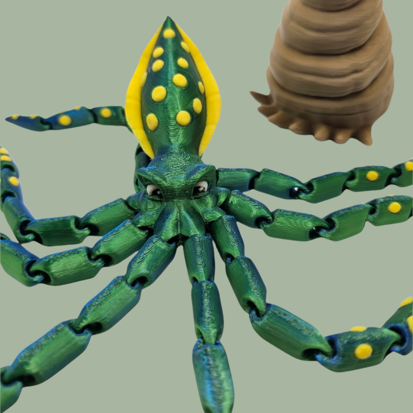 3D printed articulated green octopus with yellow spots and removeable shell hat