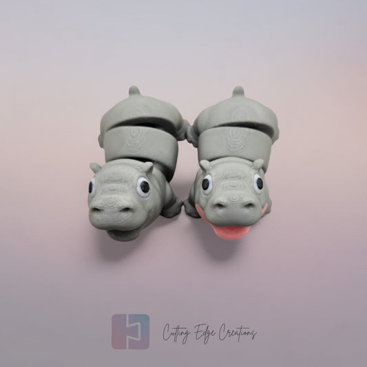 Pair of 3D printed happy flexi baby hippos, one with a pink throat/neck