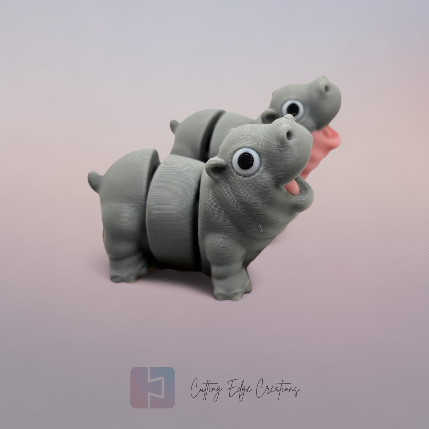 Pair of 3D printed happy flexi baby hippos, one with a pink throat/neck