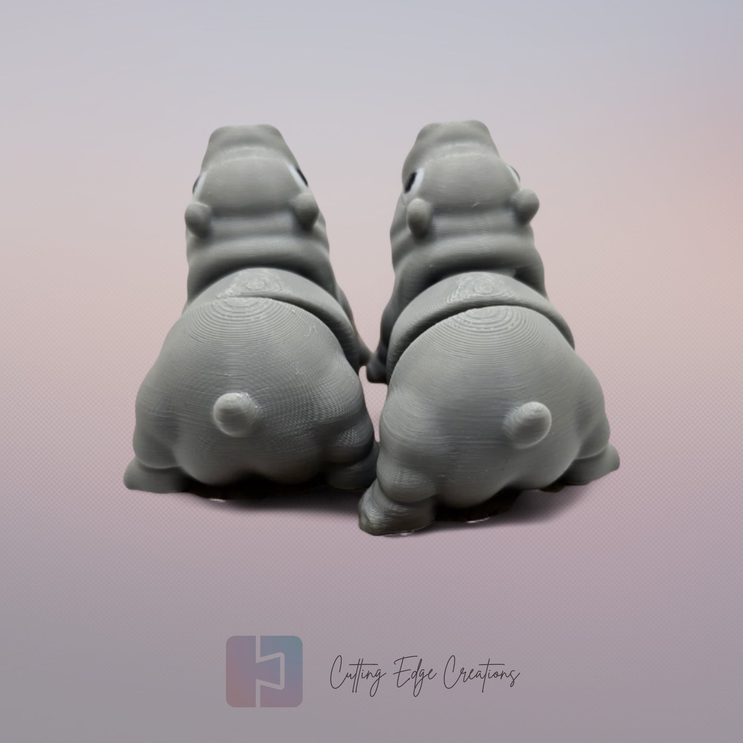 Pair of 3D printed happy flexi baby hippos, one with a pink throat/neck