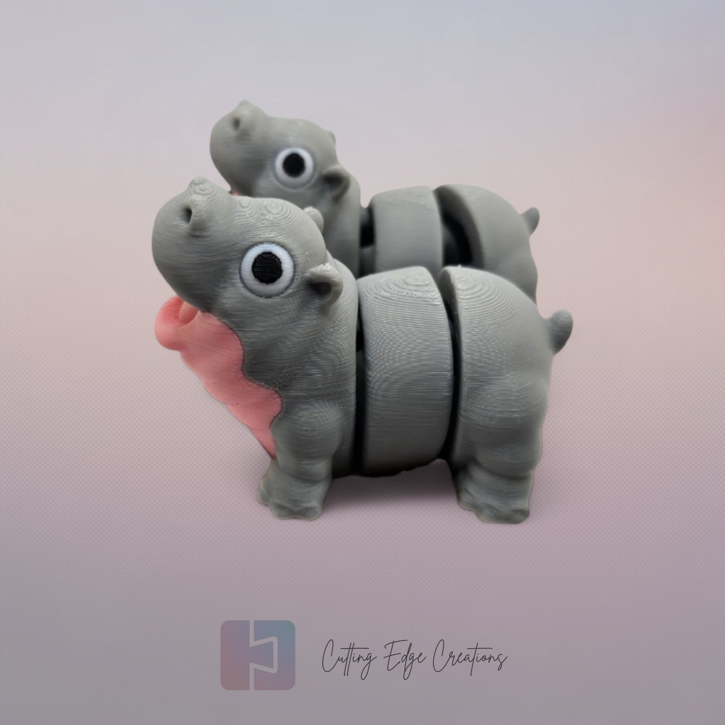 Pair of 3D printed happy flexi baby hippos, one with a pink throat/neck