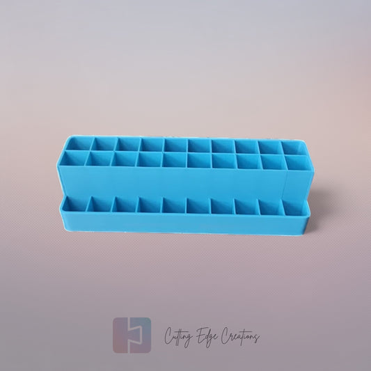 3D printed blending marker and pen stand holding colourful markers and lids on a tidy artist’s desk