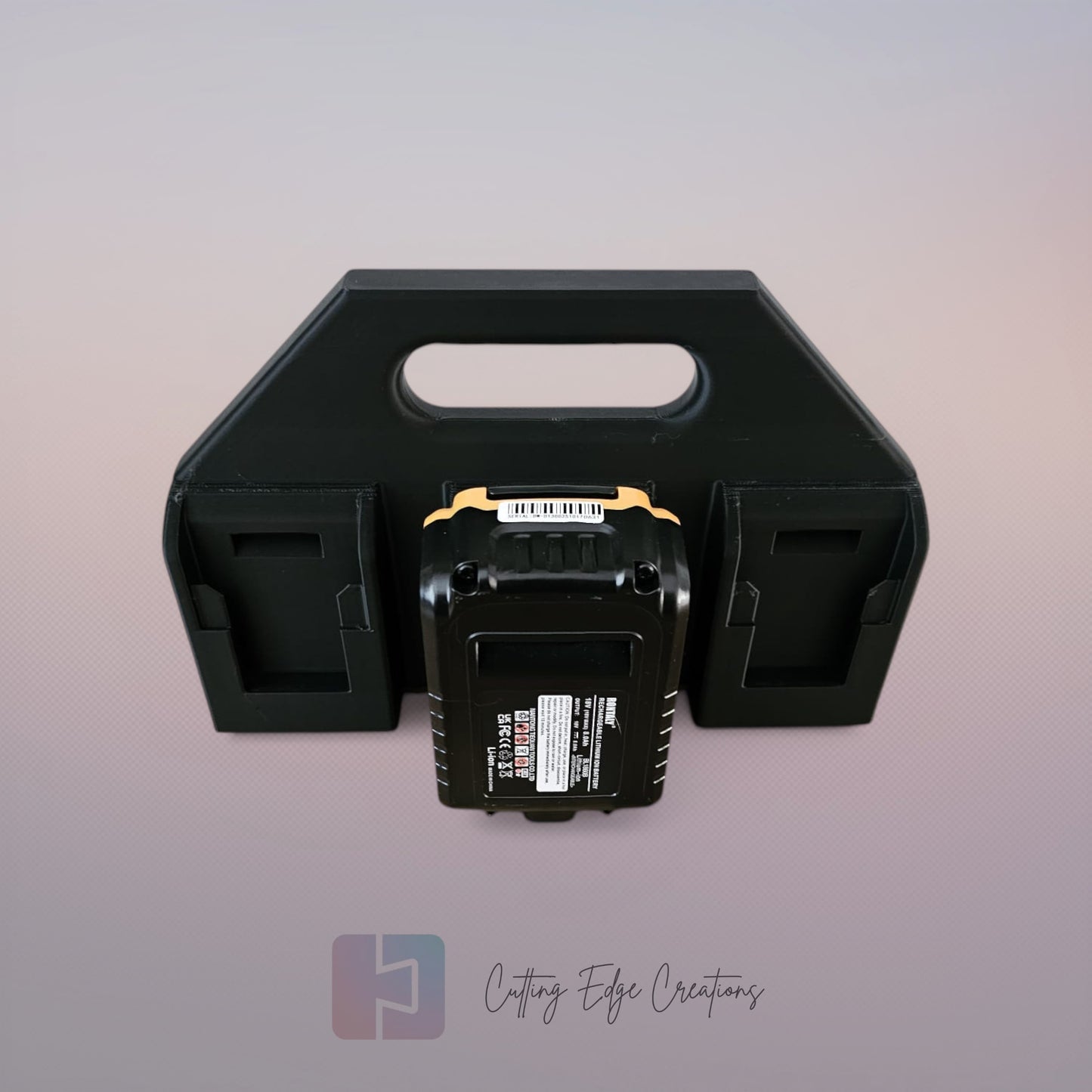 Black 3D printed battery caddy compatible with DeWalt batteries holding six batteries on wooden workbench in workshop.