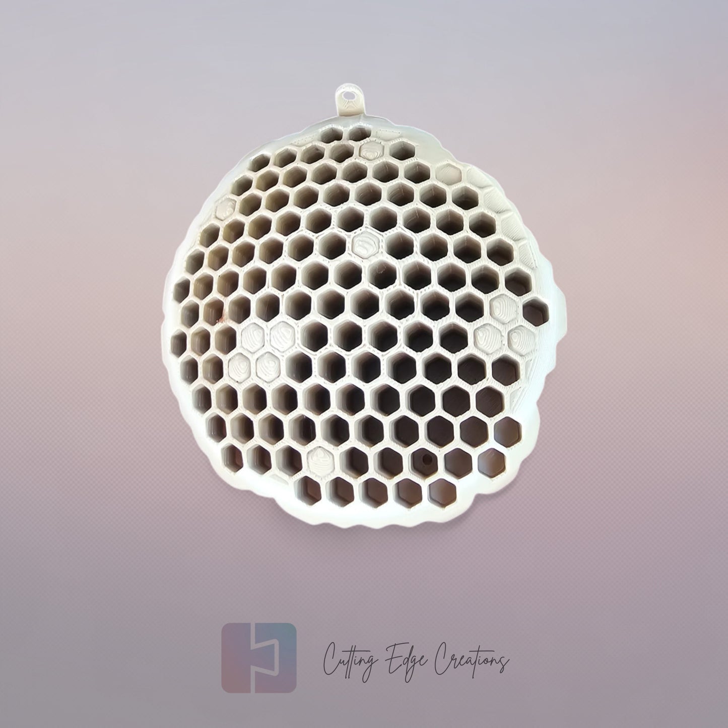 A 3D printed fake wasp nest with a honeycomb pattern, mounted under a wooden shed roof to deter real wasps.