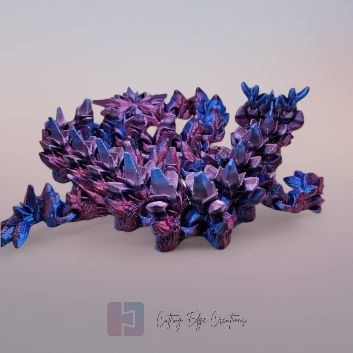 3D printed articulated Winter Dragon, flexible toy, handmade in the UK, desk fidget and gift.