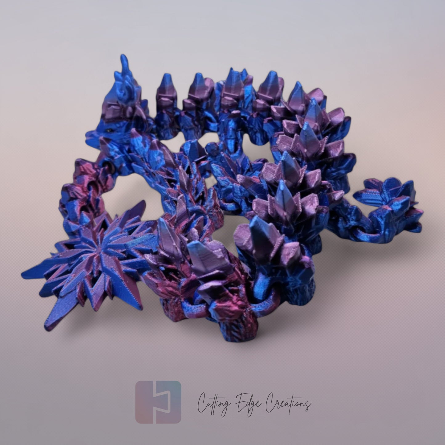 3D printed articulated Winter Dragon, flexible toy, handmade in the UK, desk fidget and gift.
