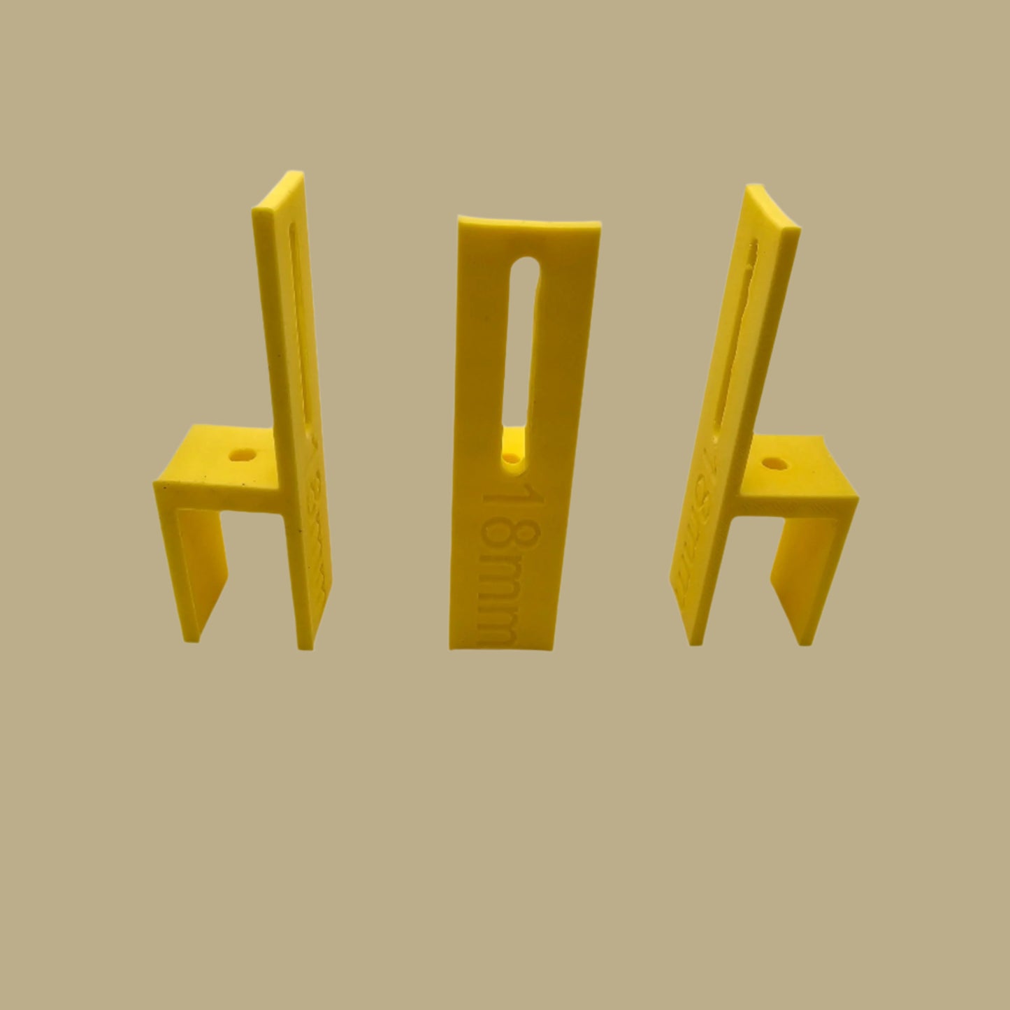 Set of three U Scribe jigs in bright colours for cabinet scribing and panel fitting