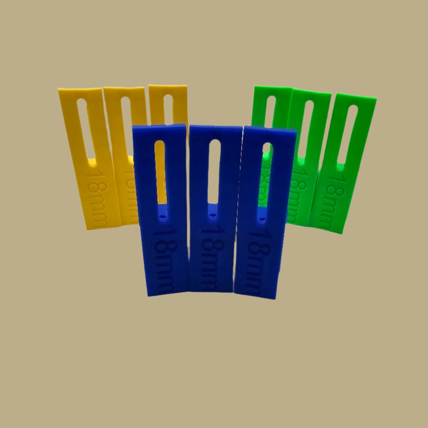 Set of three U Scribe jigs in bright colours for cabinet scribing and panel fitting