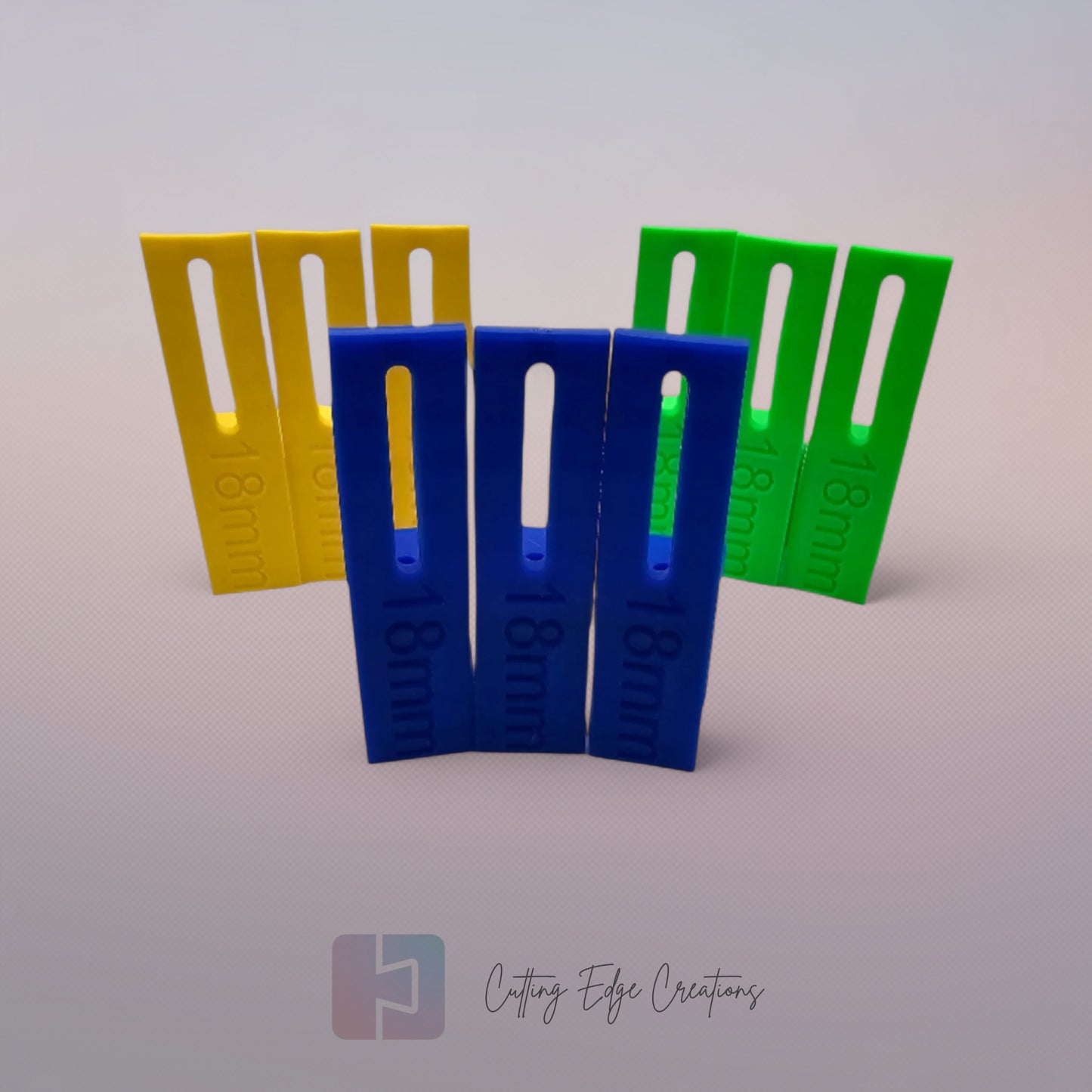 Set of three U Scribe jigs in bright colours for cabinet scribing and panel fitting