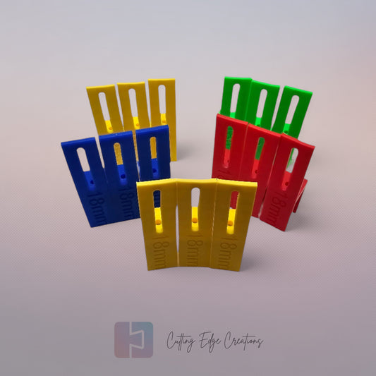 Set of three U Scribe jigs in bright colours for cabinet scribing and panel fitting