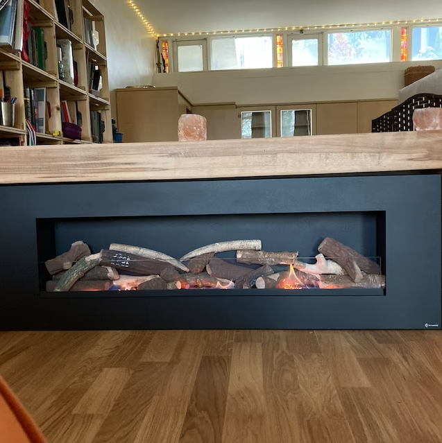 Handmade rustic oak beam mantel mounted on wall with concealed fixings