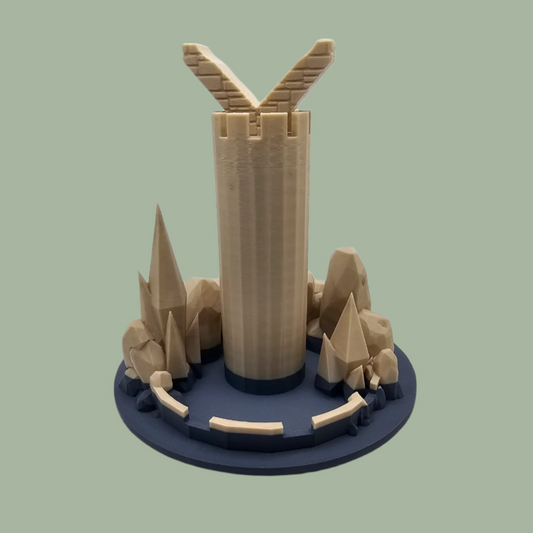 3D printed stone tower surrounded by rocky outcrops designed to hold and display a dragon