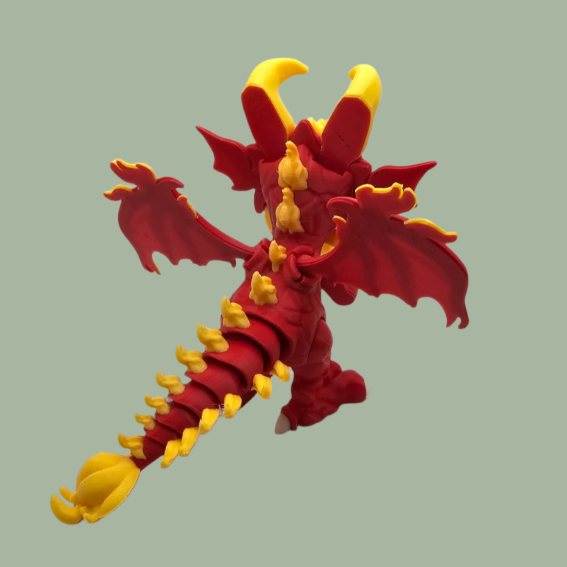 3D printed dragon figurine with fixed wings with red and yellow flame details