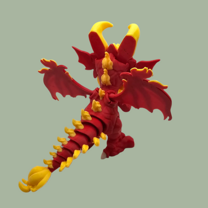 3D printed dragon figurine with fixed wings with red and yellow flame details