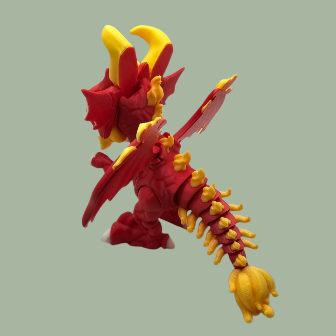 3D printed dragon figurine with fixed wings with red and yellow flame details