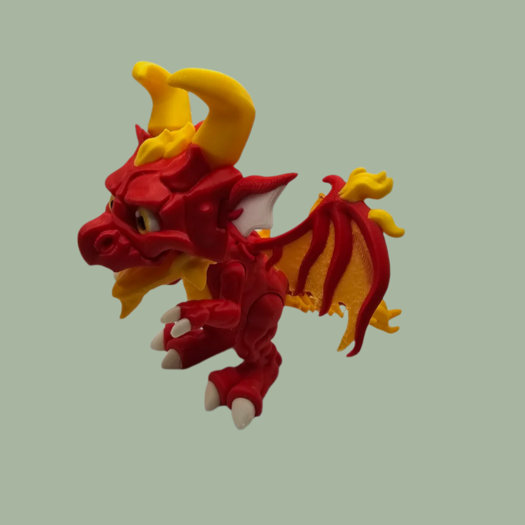 3D printed dragon figurine with fixed wings with red and yellow flame details
