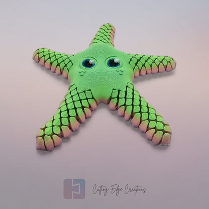 3D printed starfish with mesh articulated arms in a random pastel rainbow colour