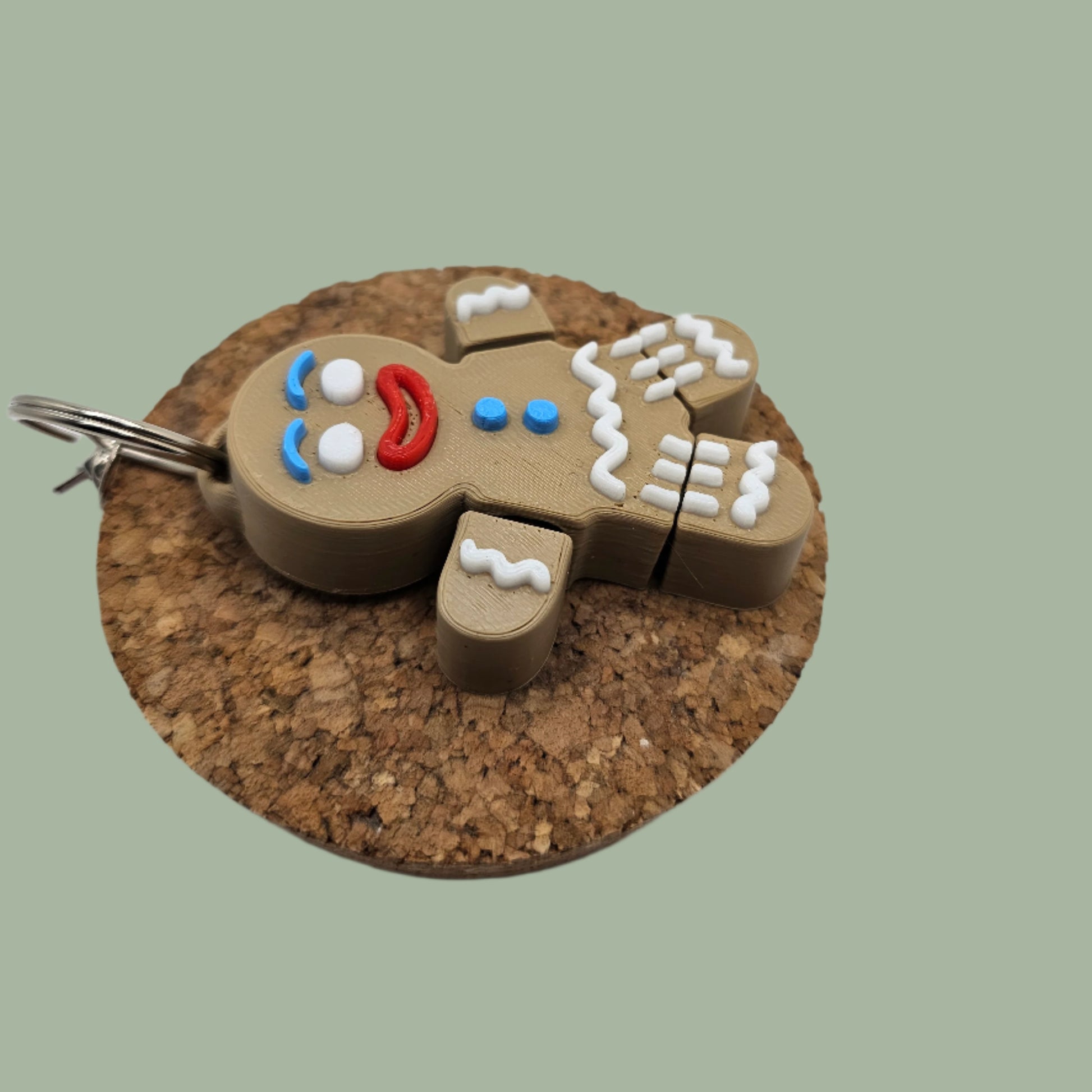 3D printed articulated gingerbread man keyring with icing detail