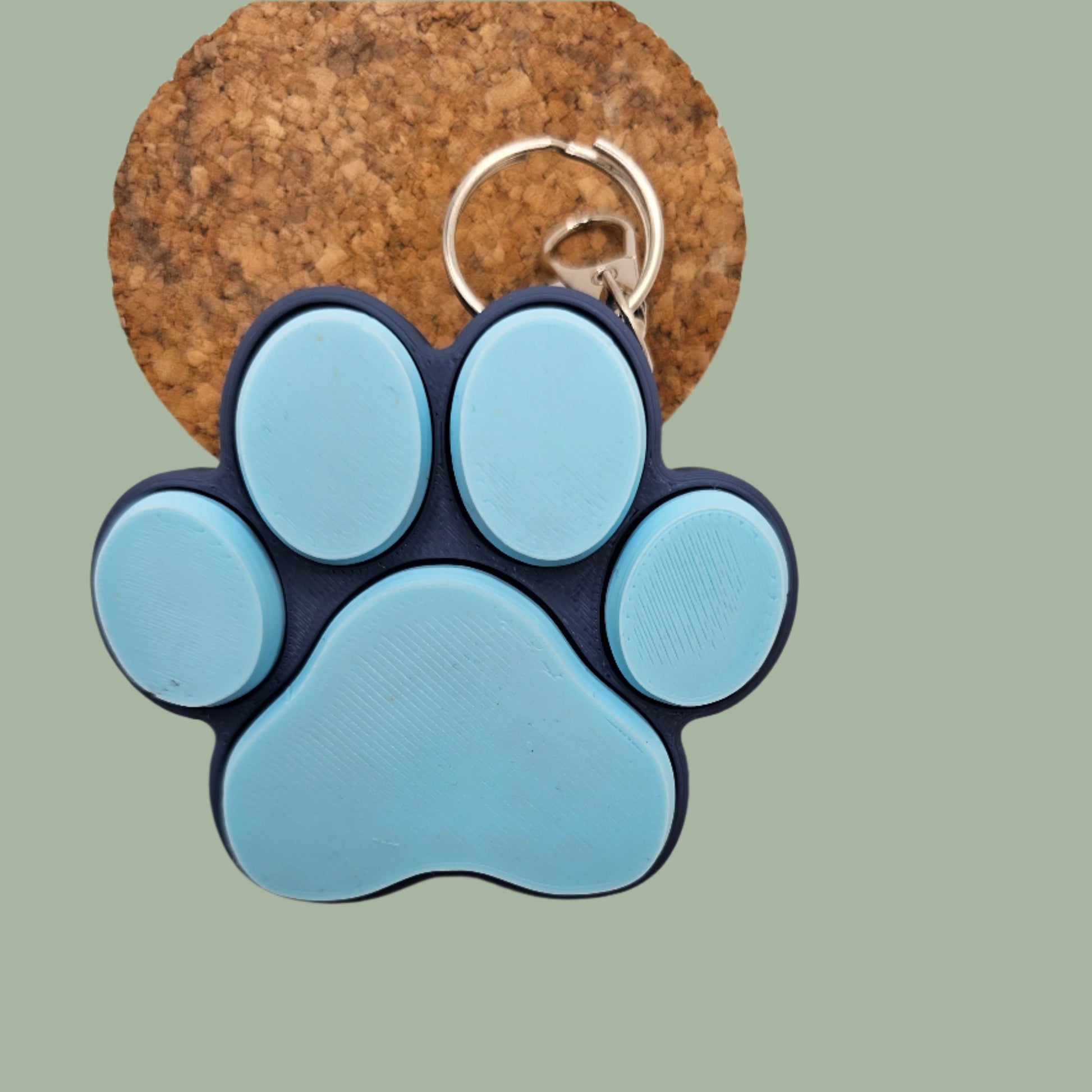 3D printed cat paw with 5 clickable buttons in a random pastel colour