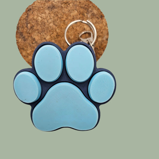 3D printed cat paw with 5 clickable buttons in a random pastel colour