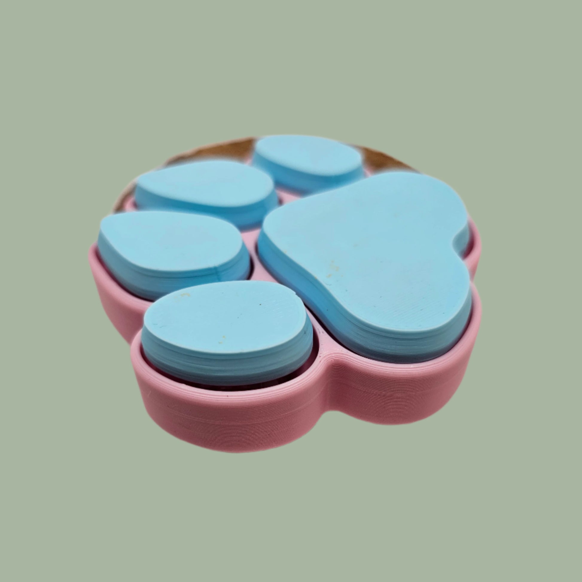 3D printed dog paw with 5 clickable buttons in a random pastel colour