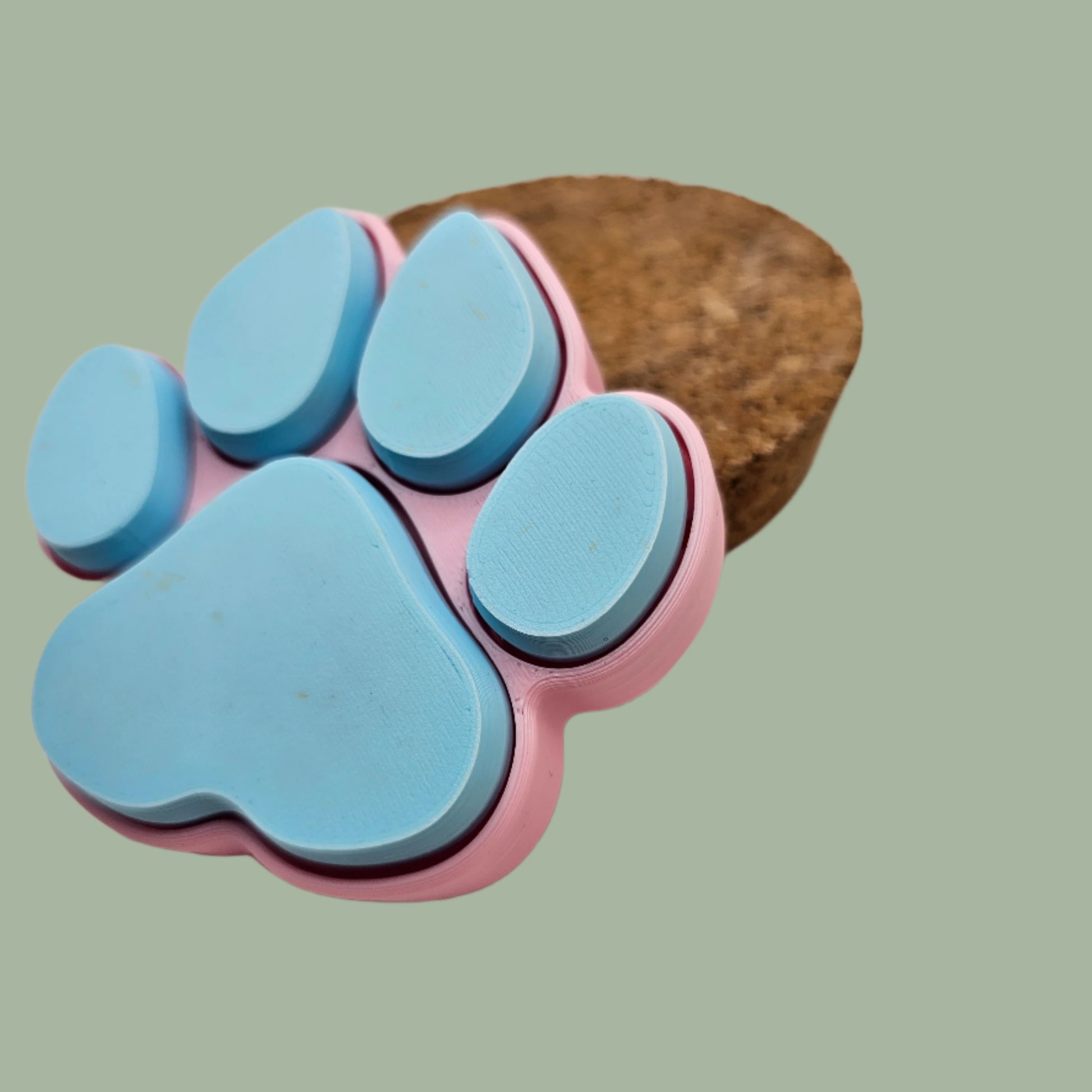 3D printed dog paw with 5 clickable buttons in a random pastel colour