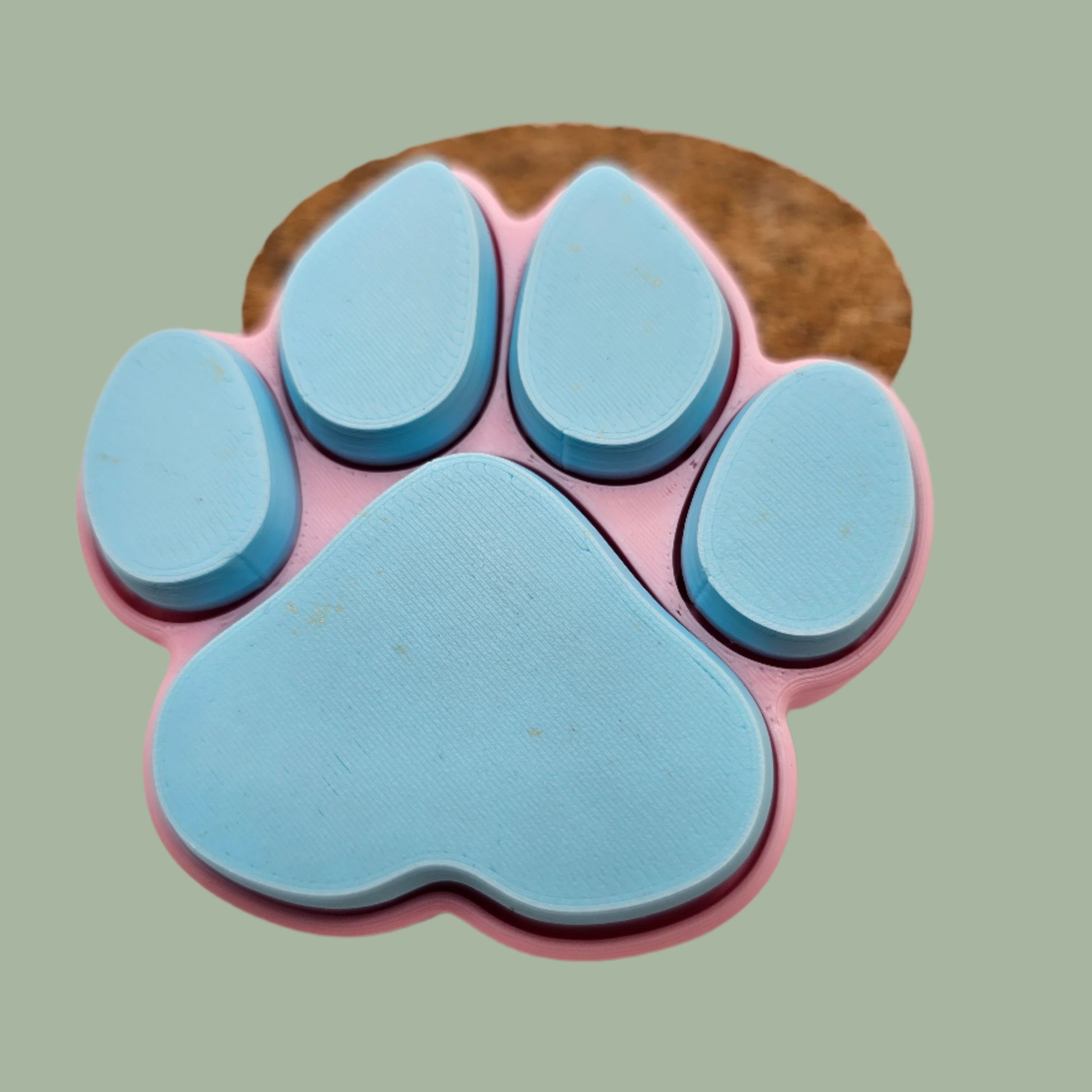 3D printed dog paw with 5 clickable buttons in a random pastel colour