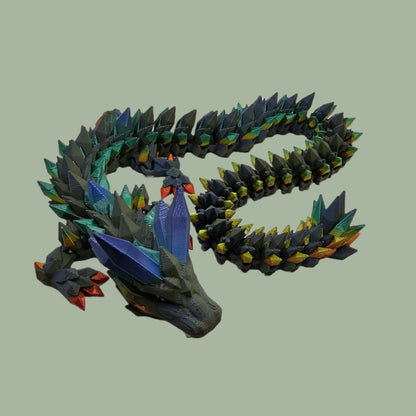 3D printed crystal style dragon in green with rainbow detail along the body