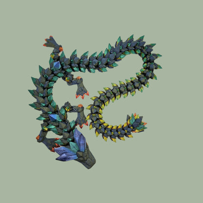 3D printed crystal style dragon in green with rainbow detail along the body