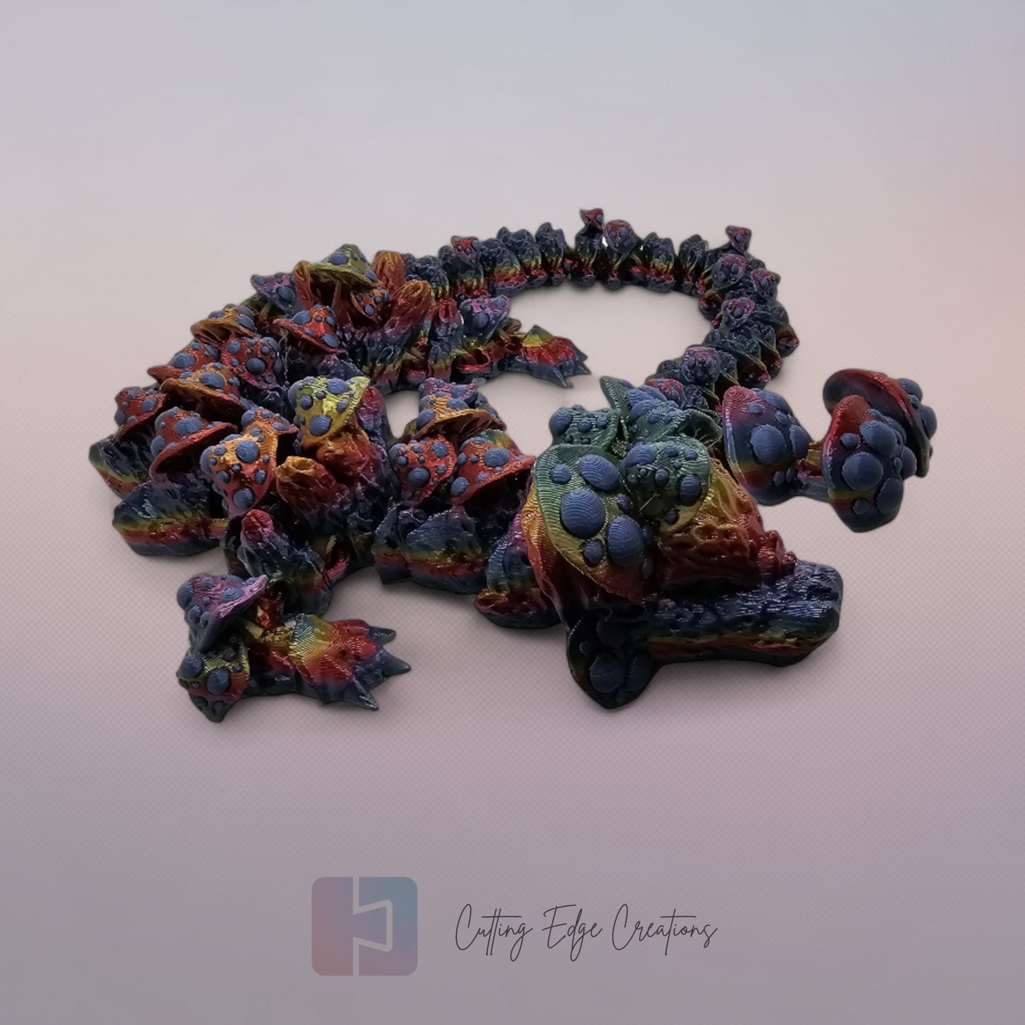 3D printed articulated Mushroom Dragon, flexible toy, handmade in the UK, desk fidget and gift.