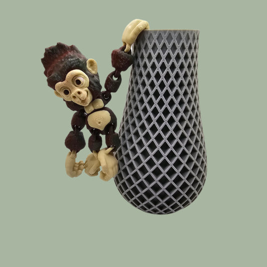 3D printed Hang Around Gorilla figurine with hook hands and feet, designed to hang from shelves, plants, and more.