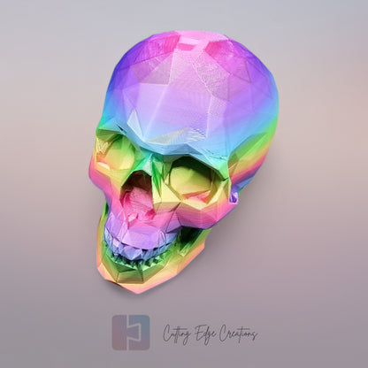 3D-printed low-poly rainbow skull figurine, uniquely coloured with a vibrant gradient. Handmade in the UK, 12cm tall, and perfect for modern home decor or gothic-inspired interiors