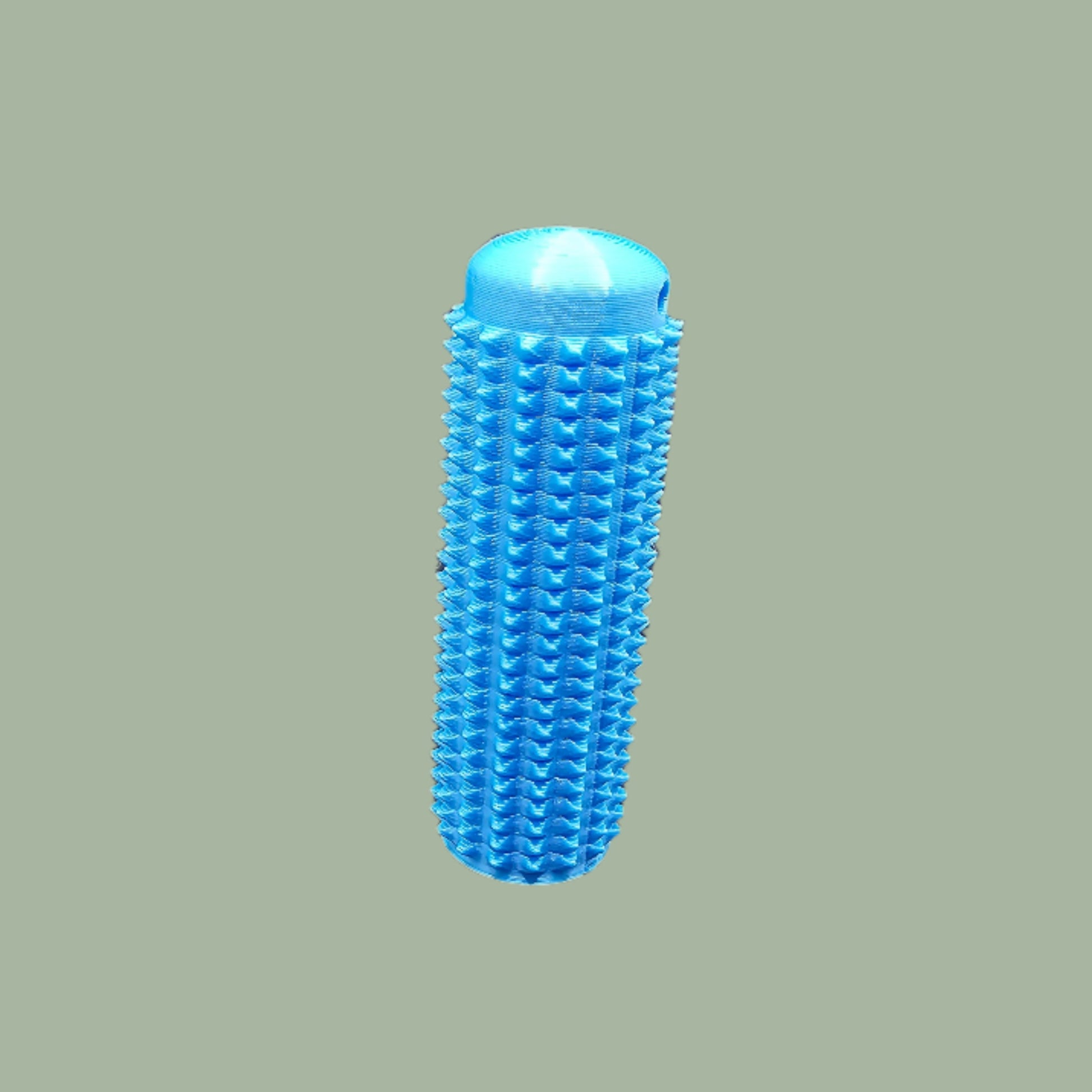 Mini Ouchie Pain Stim – a 7cm long, 3D-printed sensory tool with textured spikes for tactile stimulation, displayed against a neutral background. Includes a keychain for easy portability