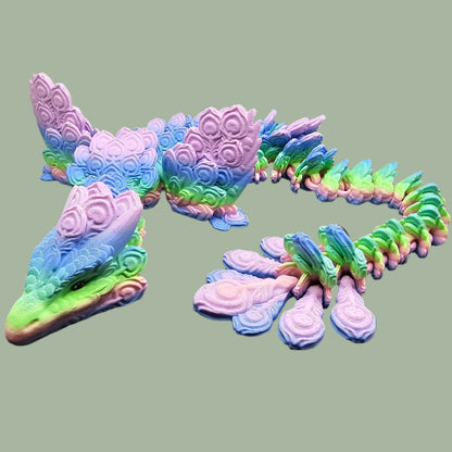 3D-printed Peacock Dragon figurine in pastel rainbow colours, featuring intricate feather-like scales and an articulated body. Handmade in the UK, available in medium, large, and X-large, with or without wings. A stunning, poseable dragon perfect for collectors and fantasy lovers